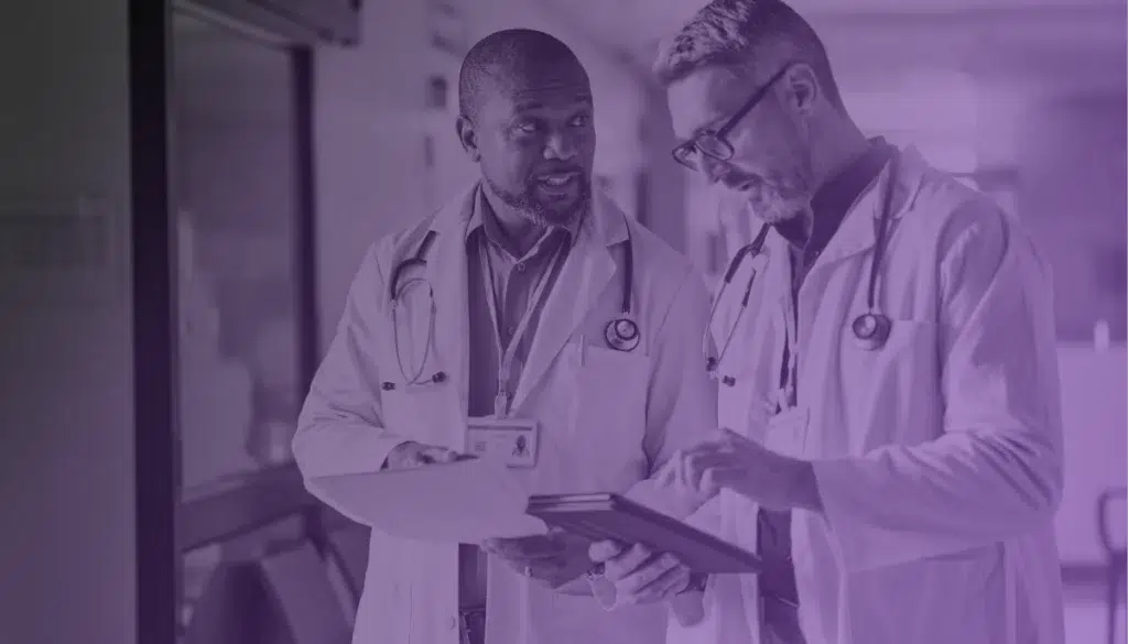 Doctors discussing how to resolve healthcare’s biggest financial challenges