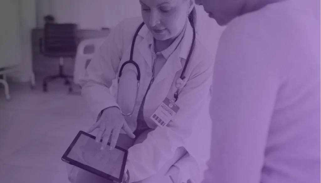 Doctor and patient overcoming HC revenue cycle challenges with IDP