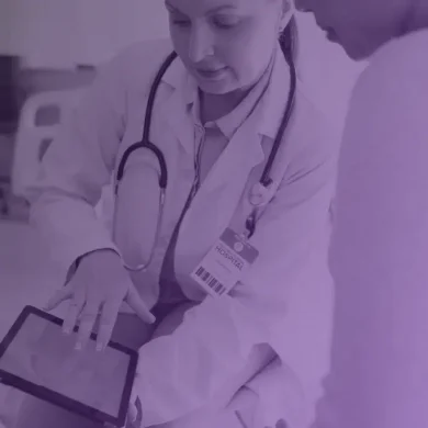 Doctor and patient overcoming HC revenue cycle challenges with IDP